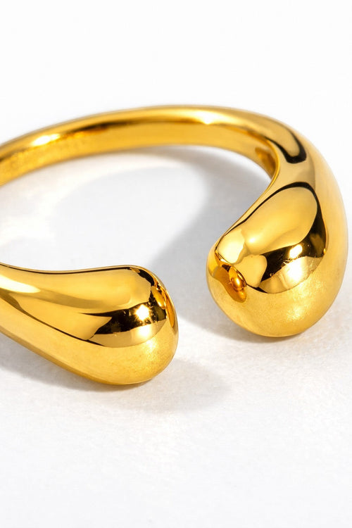 Lyza Jewels, LLC 18k gold stainless steel adjustable teardrop ring with a fluid, water-drop silhouette.