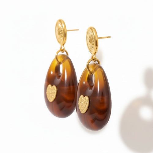 Lyza Jewels, LLC amber resin drop earrings with gold heart detail and coin studs. Hypoallergenic stainless steel.