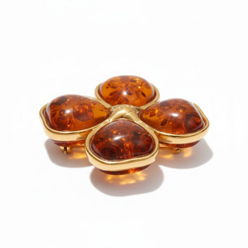 Lyza Jewels, LLC gold-tone clover brooch with amber resin cabochons. Adjustable ring.