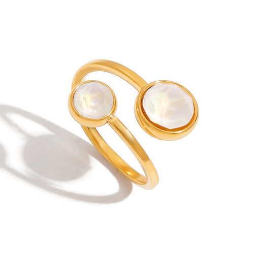 Lyza Jewels, LLC adjustable 18k gold plated stainless steel ring with two round white cubic zirconia stones.
