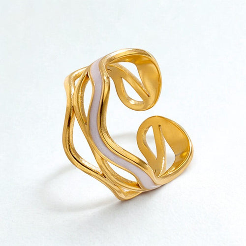 Lyza Jewels, LLC adjustable 18k gold plated stainless steel ring with white enamel inlay and irregular design.