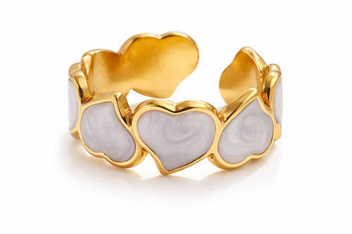 Lyza Jewels, LLC adjustable gold-tone stainless steel ring with connected white enamel hearts.
