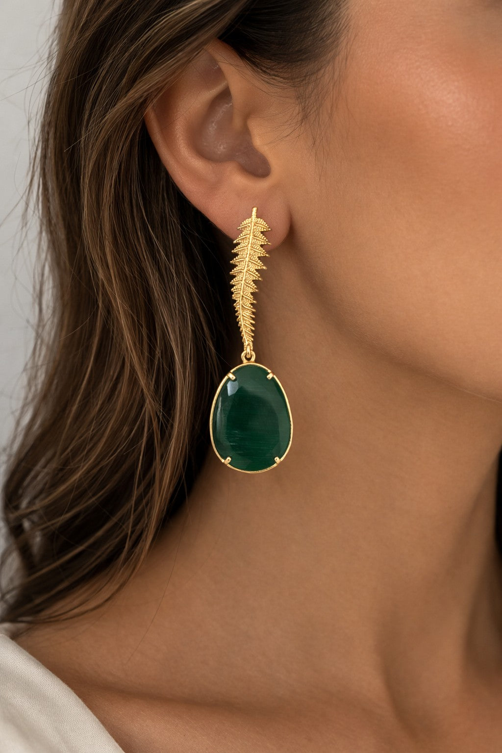 Lyza Jewels, LLC gold plated brass drop earrings with leafy design and oval green gemstone.