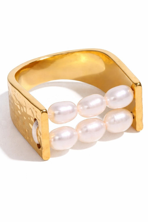 Lyza Jewels, LLC gold-plated stainless steel adjustable ring with double band and freshwater pearls.