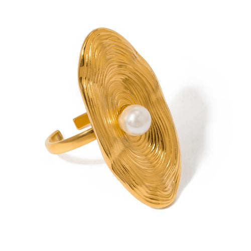 Lyza Jewels, LLC 18k gold-tone stainless steel ring with textured oval face and pearl centerpiece.