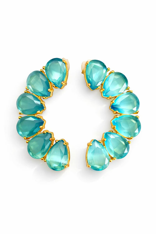 Lyza Jewels, LLC 18K gold plated brass earrings with teardrop turquoise stones in a crescent shape.