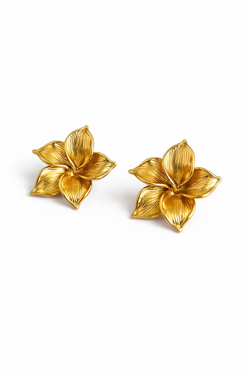 Lyza Jewels, LLC gold-tone 18K stainless steel plumeria flower stud earrings with detailed petals.