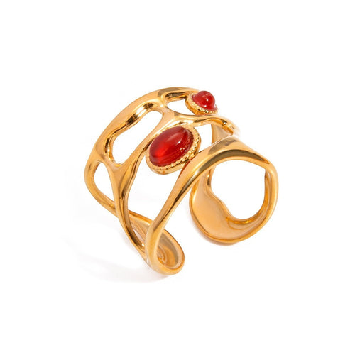 Lyza Jewels, LLC gold-tone adjustable ring with hollow design and three red cabochon stones.