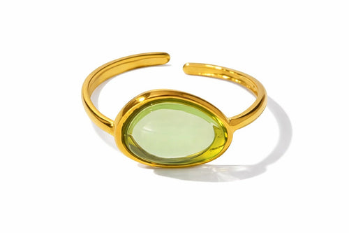 Lyza Jewels, LLC adjustable gold stainless steel ring with oval light green resin stone.