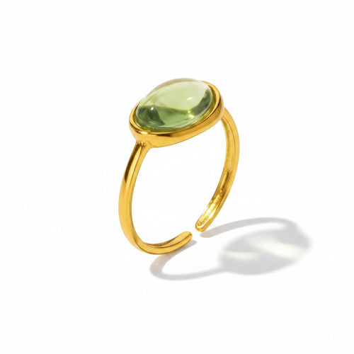 Lyza Jewels, LLC gold stainless steel adjustable ring with oval green resin stone. Coastal charm and durable design.