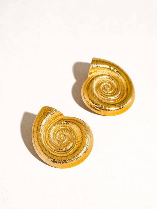 Lyza Jewels, LLC 18k gold brushed stainless steel conch spiral earrings with a nature-inspired design.