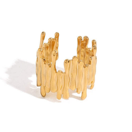 Lyza Jewels, LLC 18k gold stainless steel asymmetrical ring with a dripping wax design. Adjustable and hypoallergenic.