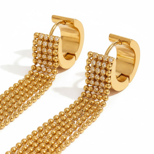 Lyza Jewels, LLC gold-tone stainless steel hoop earrings with cascading ball chain tassels and crystal accents.