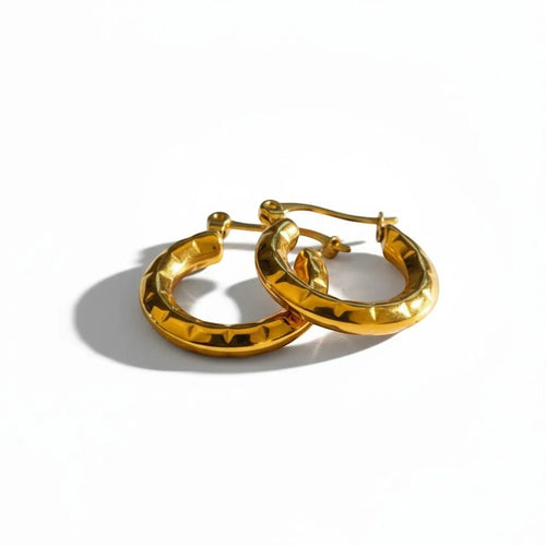 Lyza Jewels, LLC gold textured crescent hoop earrings made of stainless steel with a honeycomb pattern.