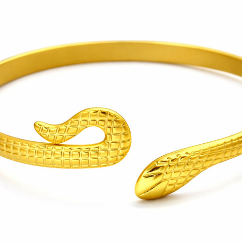 Lyza Jewels, LLC gold-tone serpentine open cuff bracelet with intricate textured snake scale detailing.