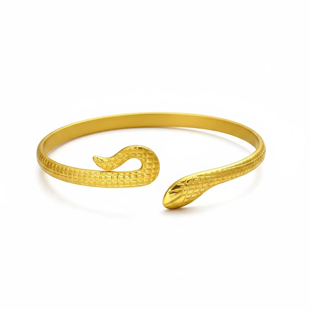 Lyza Jewels, LLC gold-tone serpentine open cuff bracelet with textured snake scale detailing.