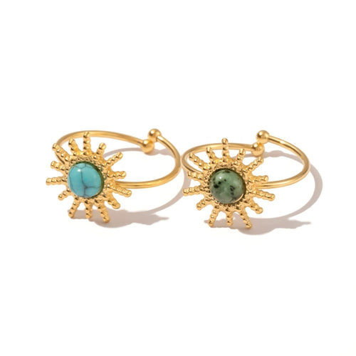 Lyza Jewels, LLC adjustable gold stainless steel ring with a turquoise sun face and a green sun face.