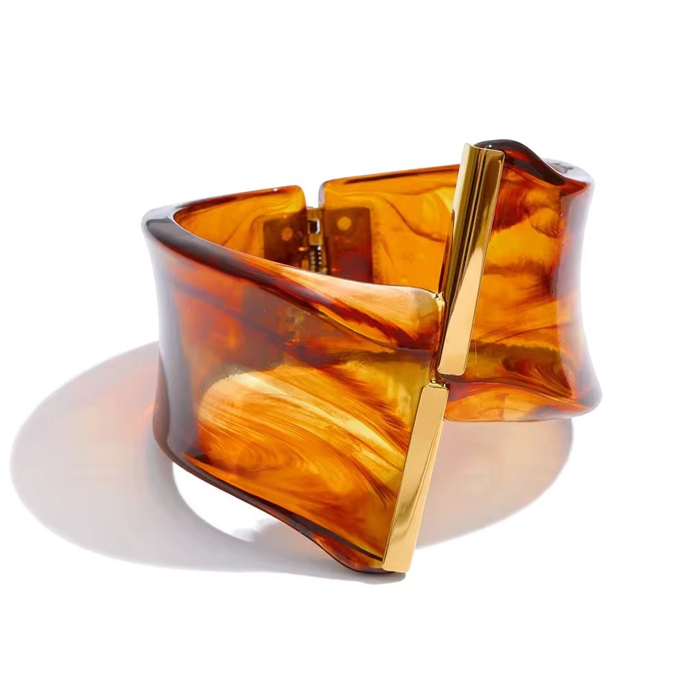 Lyza Jewels, LLC tortoiseshell resin cuff bracelet with polished gold-tone metal hardware and architectural design.