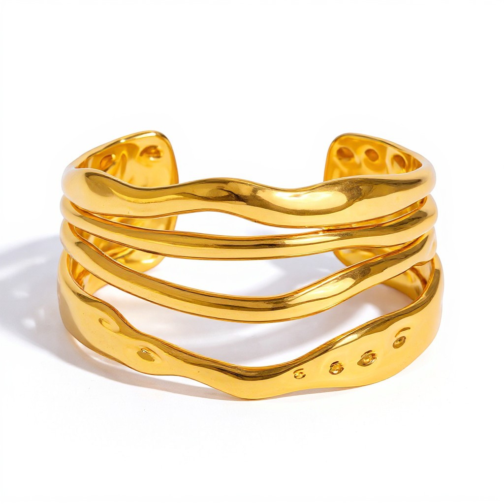 Lyza Jewels, LLC wavy multi-band gold cuff bracelet with a high-polish finish and open-cuff design.